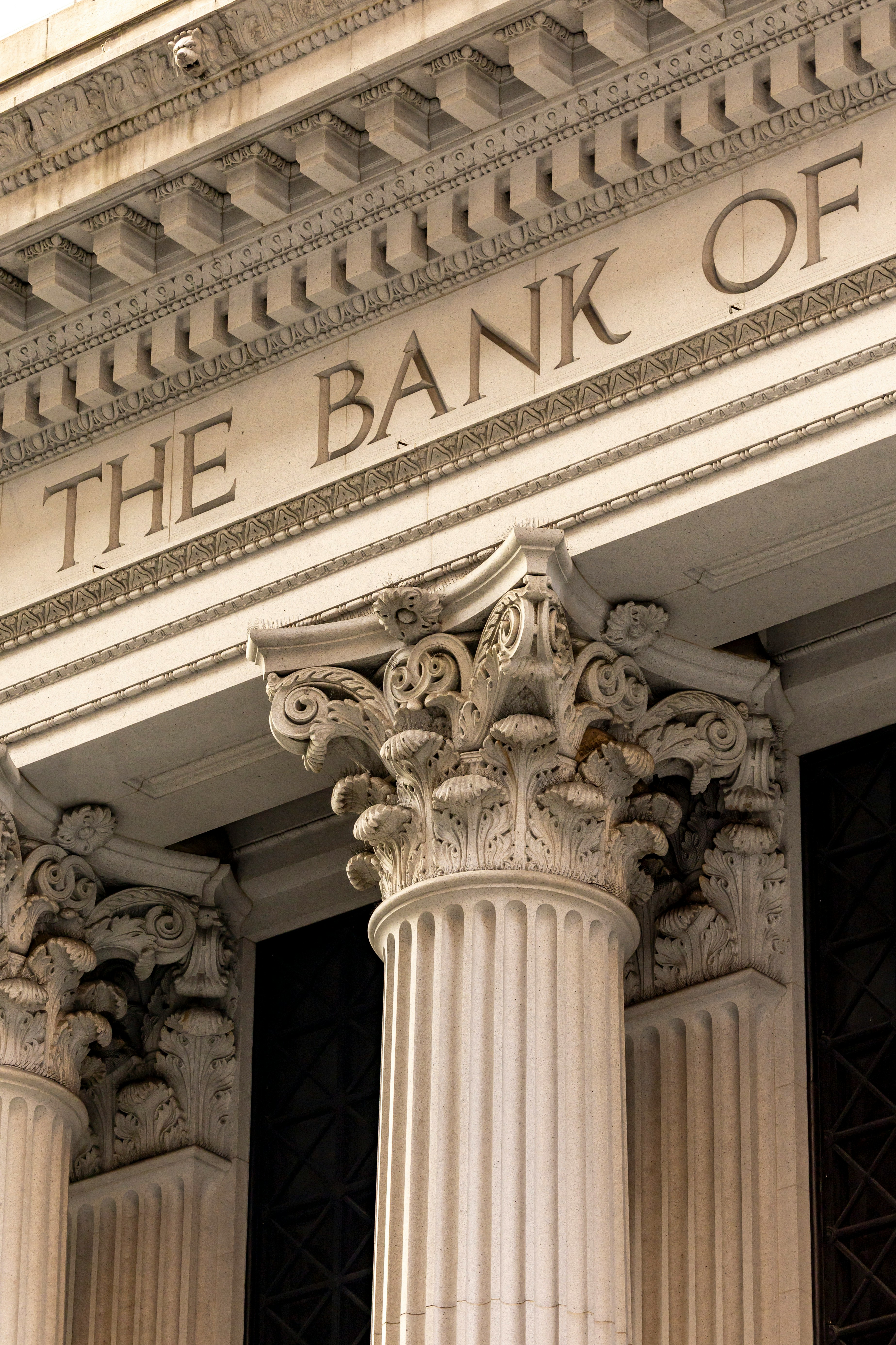 Detail of classical banking architecture with fluted columns beneath the inscription The Bank Of